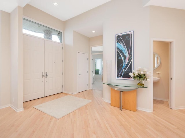 2673 Cedar Grn, Minnetonka, MN 55305 - foyer featuring wood finished floors, baseboards, and recessed lighting