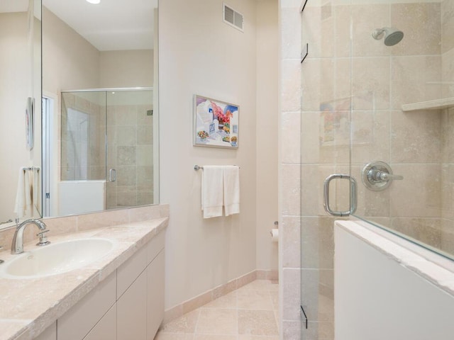 2673 Cedar Grn, Minnetonka, MN 55305 - bathroom with a stall shower, baseboards, vanity, and tile patterned floors