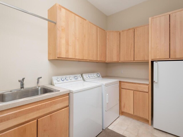 2673 Cedar Grn, Minnetonka, MN 55305 - laundry area featuring cabinet space and independent washer and dryer