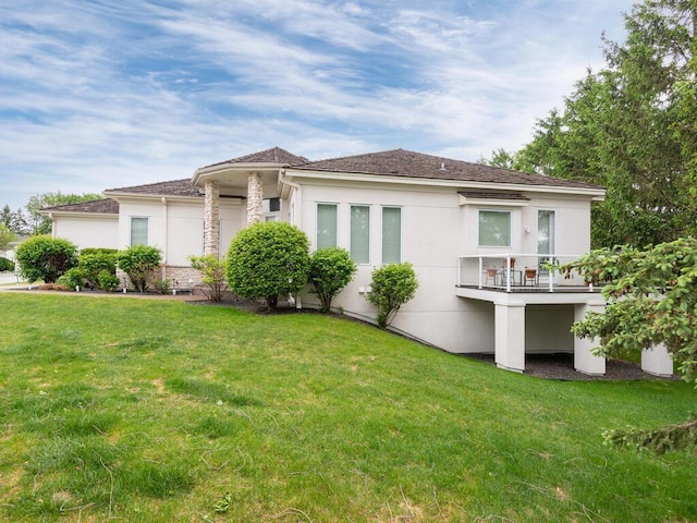 2673 Cedar Grn, Minnetonka, MN 55305 - back of property with stucco siding, a lawn, and a balcony