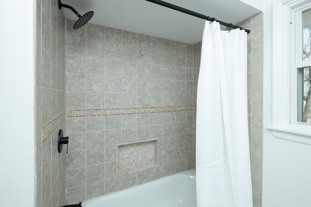 bathroom with shower / bathtub combination with curtain