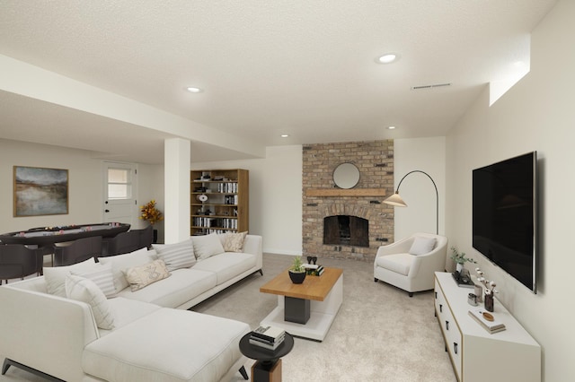 living area with a fireplace, light carpet, recessed lighting, and visible vents