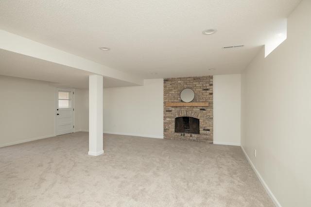 interior space featuring a brick fireplace, baseboards, light colored carpet, and visible vents