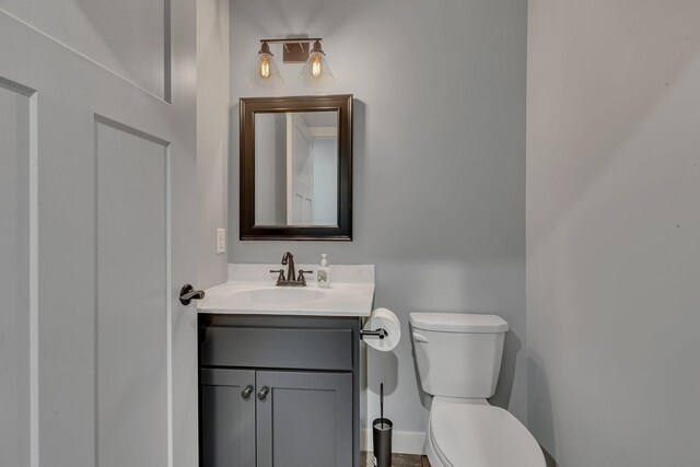 8619 State Highway 55 NW, Annandale, MN 55302 - half bath with vanity, baseboards, and toilet
