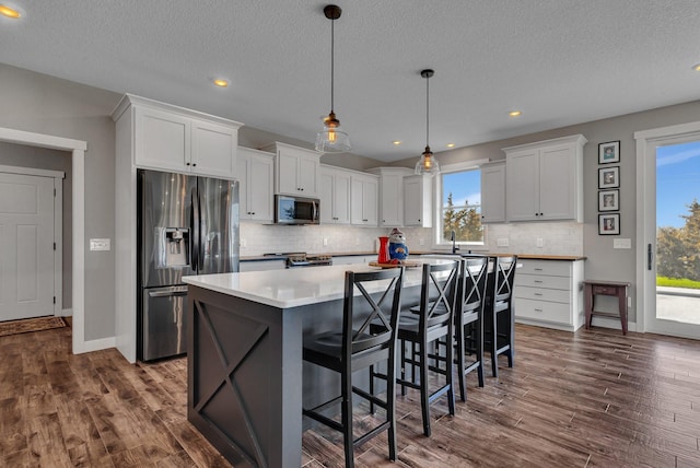 8619 State Highway 55 NW, Annandale, MN 55302 - kitchen with appliances with stainless steel finishes, white cabinets, and tasteful backsplash