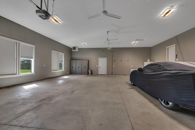 8619 State Highway 55 NW, Annandale, MN 55302 - garage featuring a garage door opener and ceiling fan