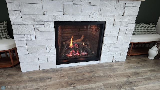 room details with wood finished floors and a fireplace