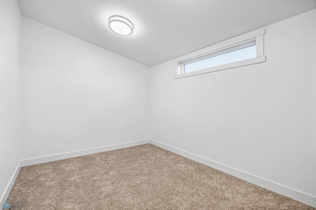 basement with carpet floors and baseboards