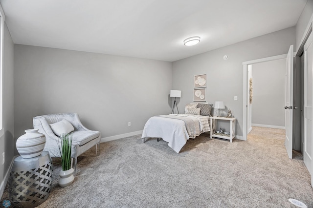 carpeted bedroom with baseboards