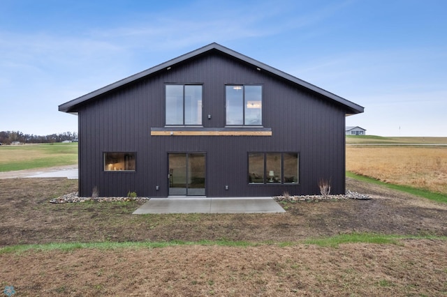 back of house with a patio