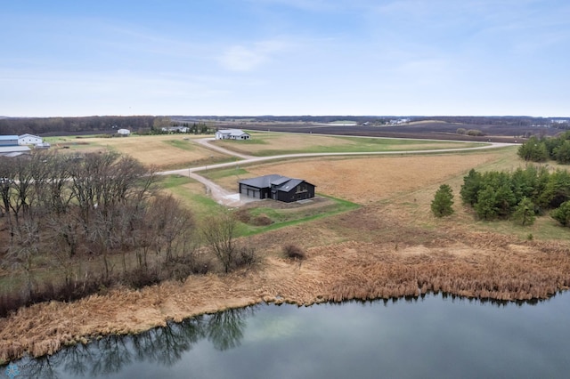 birds eye view of property featuring a water view and a rural view