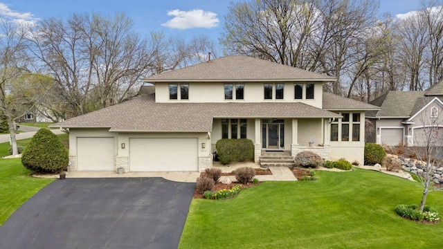 view of front facade with a shingled roof, stone siding, and stucco siding