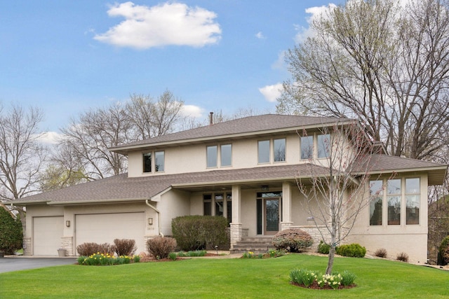 view of front of home featuring aphalt driveway, an attached garage, a shingled roof, a front lawn, and stucco siding