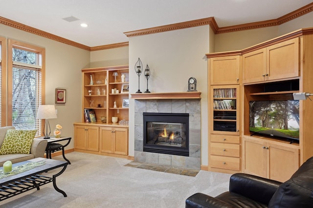 living room featuring crown molding, carpet, visible vents, and a fireplace