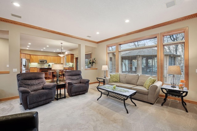 living area with crown molding, recessed lighting, baseboards, and light colored carpet