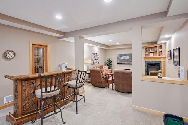bar featuring a bar, carpet, and baseboards