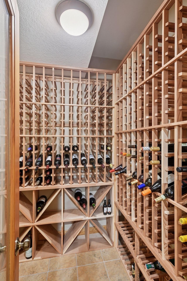 wine room featuring a textured ceiling