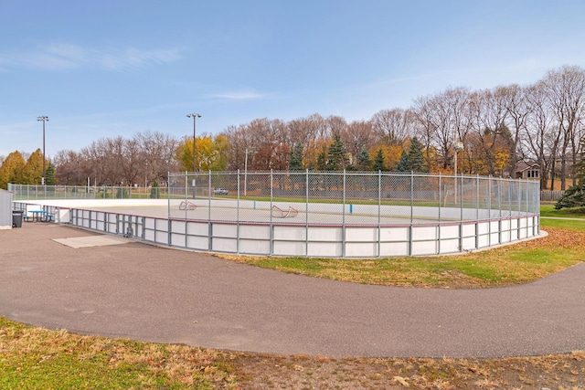 view of property's community featuring fence