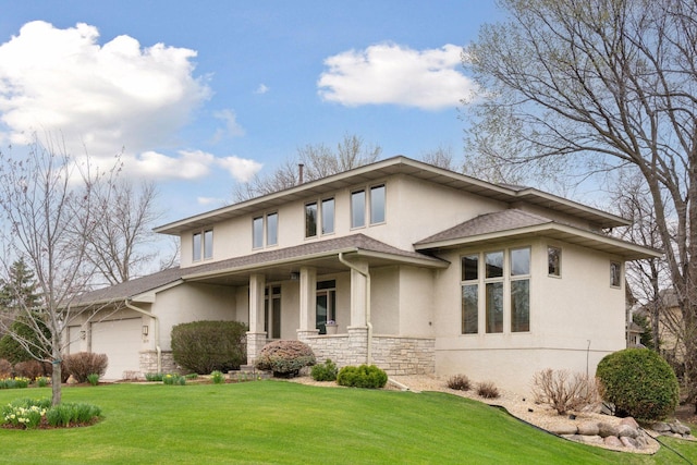 3670 Yuma Ln N, Plymouth, MN 55446 - prairie-style home with stucco siding, stone siding, a front lawn, an attached garage, and roof with shingles