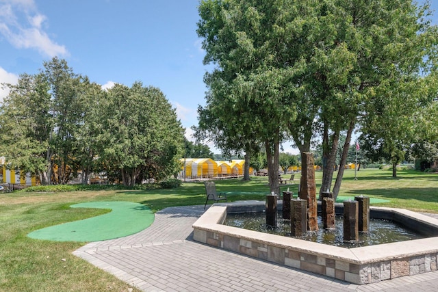 view of home's community featuring a lawn