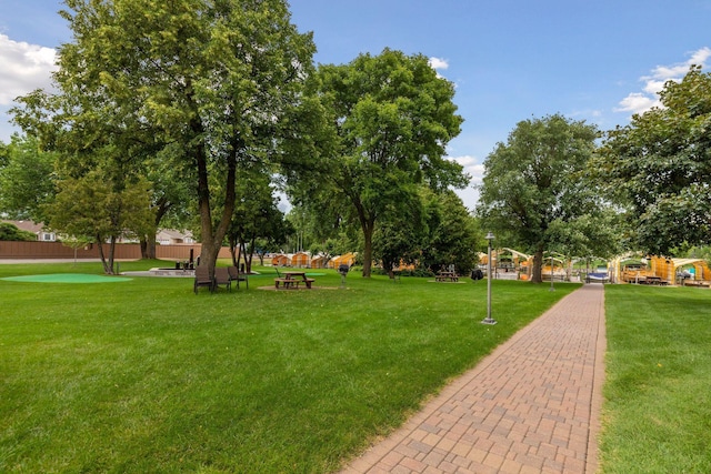 surrounding community featuring a lawn