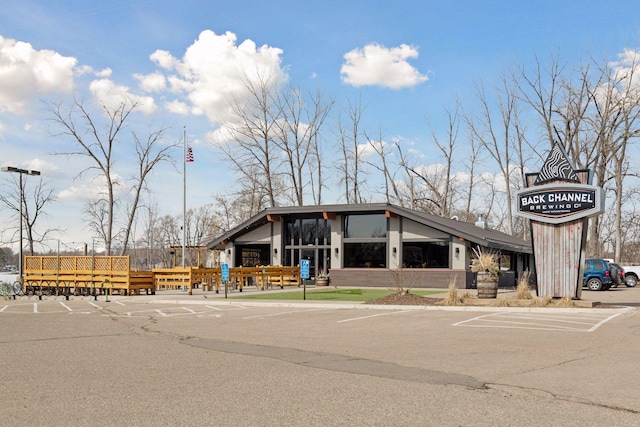 view of property featuring uncovered parking