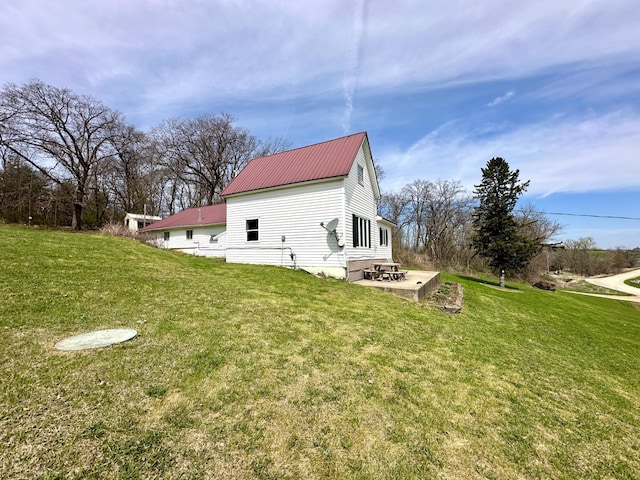 27227 Raven Rd, Spring Valley, MN 55975 - view of side of home with a yard, a patio area, and metal roof