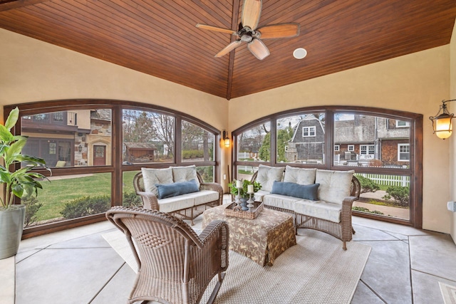 sunroom featuring wood ceiling and high vaulted ceiling