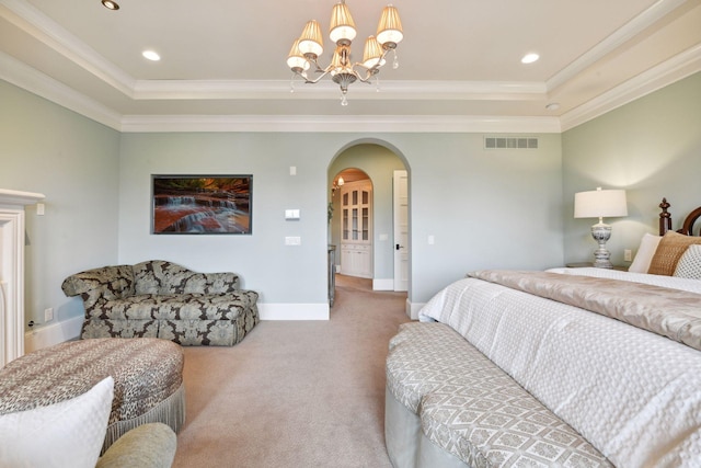 bedroom featuring visible vents, arched walkways, a raised ceiling, and carpet