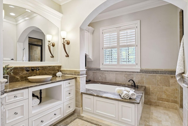 full bath featuring crown molding and tile walls