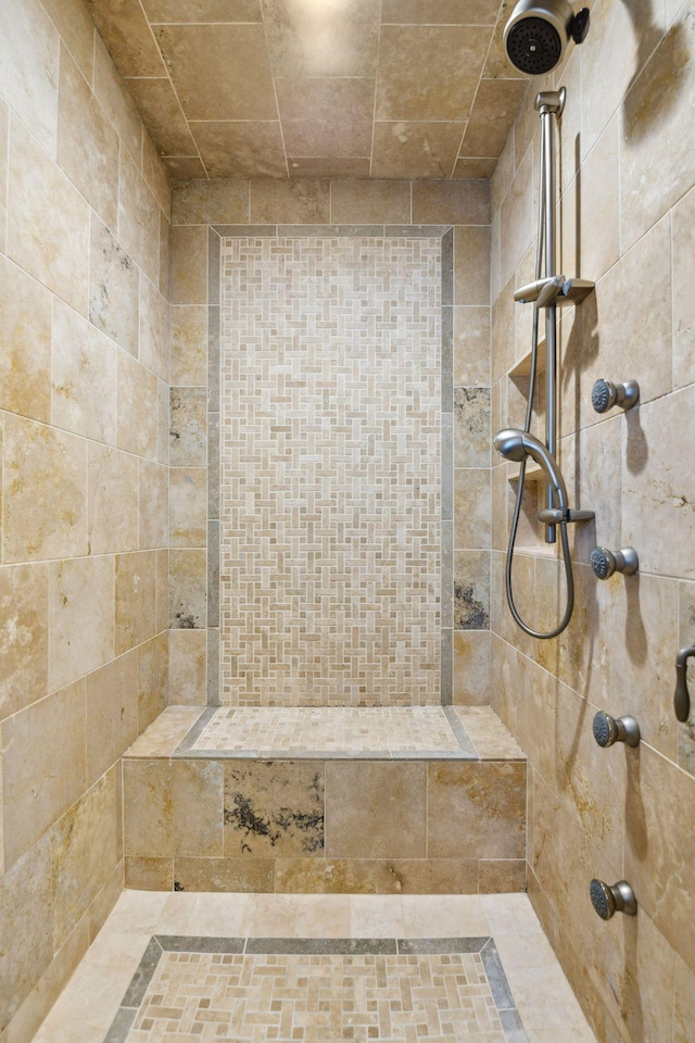 full bath with tiled shower
