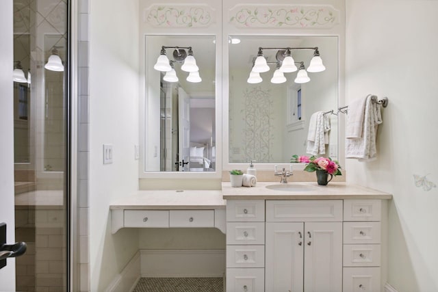 ensuite bathroom with vanity, ensuite bathroom, and tiled shower
