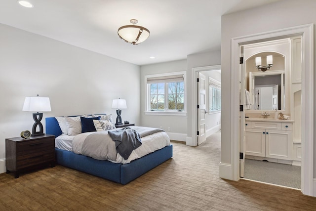 bedroom featuring carpet floors, recessed lighting, baseboards, and ensuite bathroom