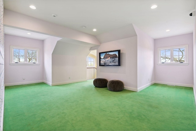 bonus room with plenty of natural light, carpet, and baseboards