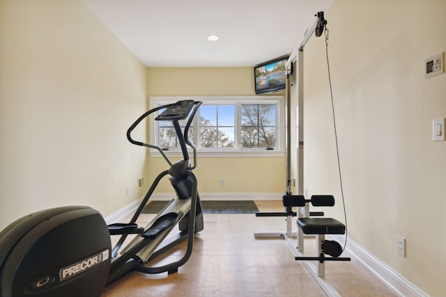 exercise room with baseboards