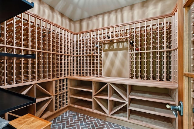 wine area featuring brick floor