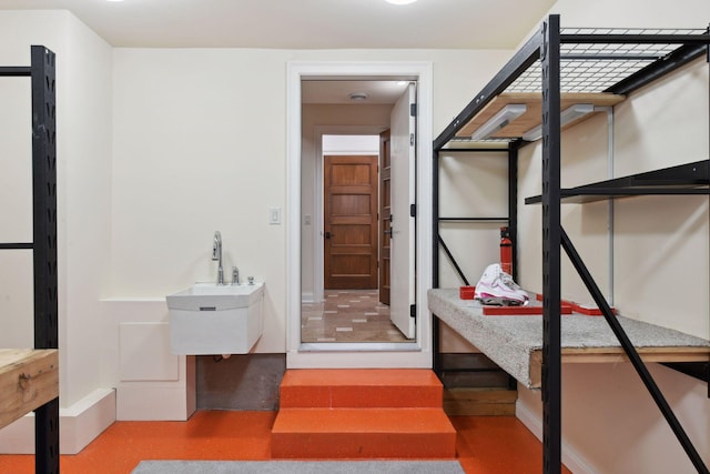bedroom featuring a sink