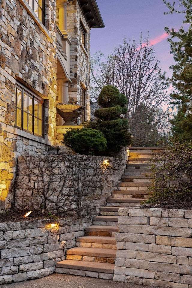 exterior space with stone siding