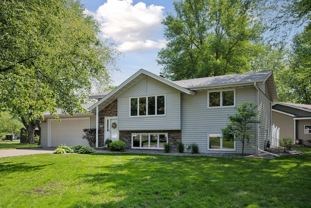 220 Willow Ln, Foley, MN 56329 - view of front of house with a garage, a front yard, and driveway