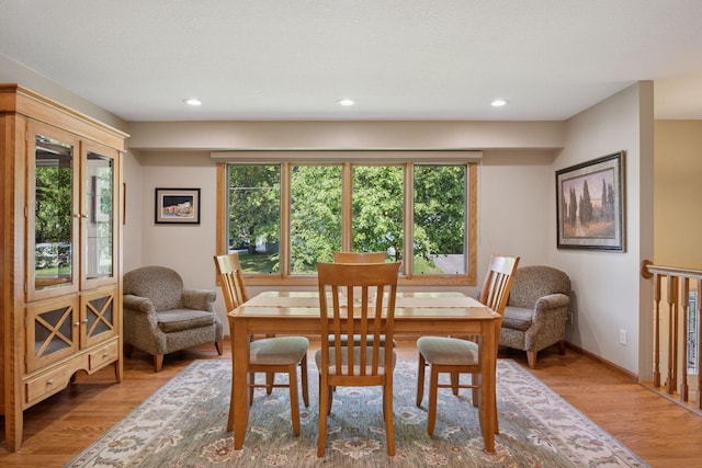 220 Willow Ln, Foley, MN 56329 - dining space featuring wood finished floors, plenty of natural light, and recessed lighting