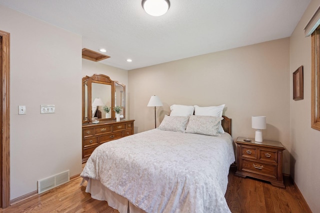 220 Willow Ln, Foley, MN 56329 - bedroom featuring wood finished floors and recessed lighting