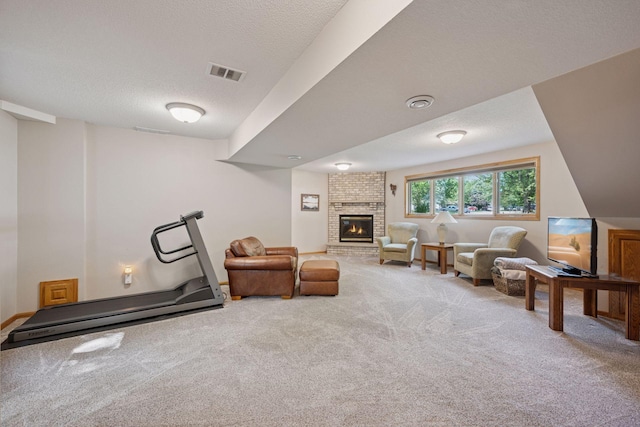 220 Willow Ln, Foley, MN 56329 - carpeted living area with a brick fireplace and a textured ceiling