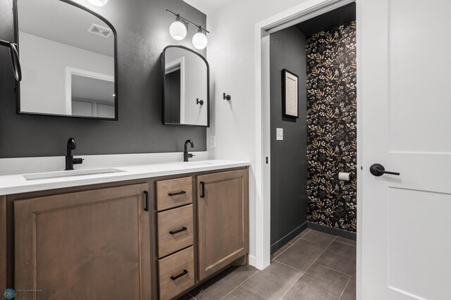 3682 Merrifield Dr S, Fargo, ND 58104 - full bath featuring double vanity, tile patterned floors, and baseboards