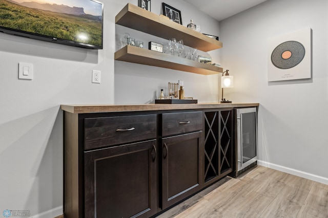 3682 Merrifield Dr S, Fargo, ND 58104 - indoor wet bar with baseboards, light wood-style flooring, and wine cooler