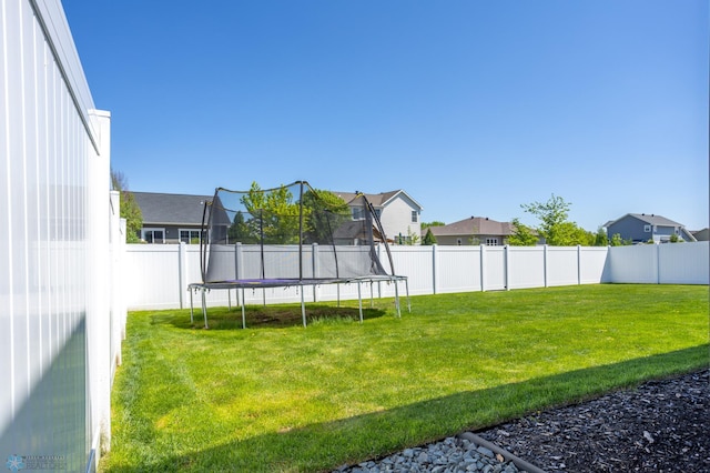 3682 Merrifield Dr S, Fargo, ND 58104 - view of yard featuring a trampoline and a residential view