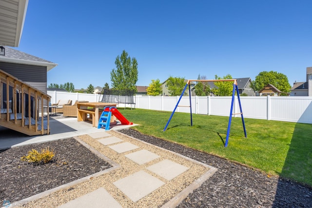 3682 Merrifield Dr S, Fargo, ND 58104 - view of yard with a playground, a trampoline, and a patio area