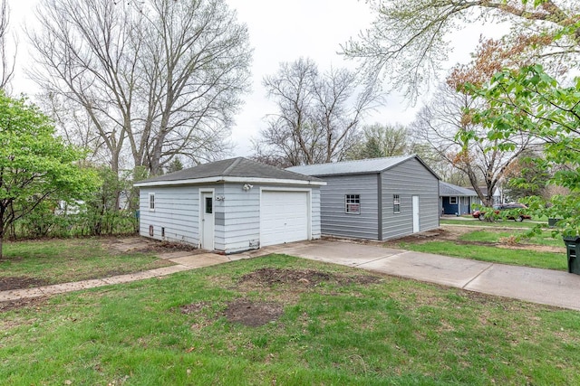 detached garage featuring driveway