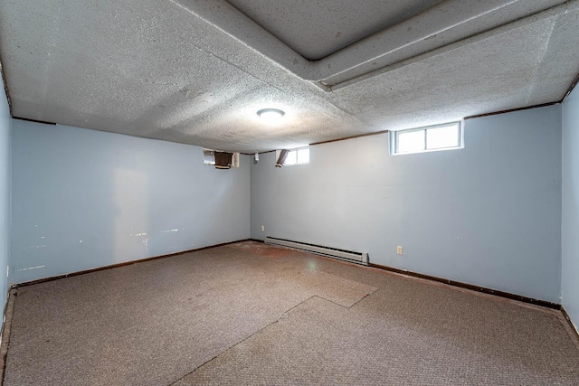 below grade area featuring baseboards, baseboard heating, and carpet