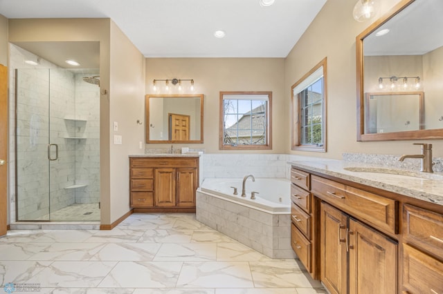 full bathroom with a garden tub, a sink, marble finish floor, and a shower stall