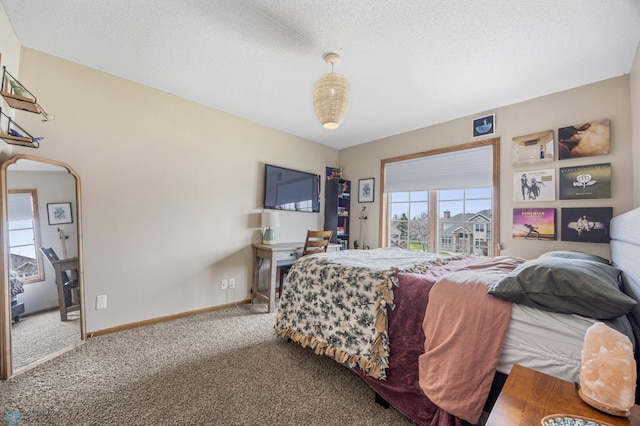 bedroom featuring carpet flooring, a textured ceiling, baseboards, and arched walkways